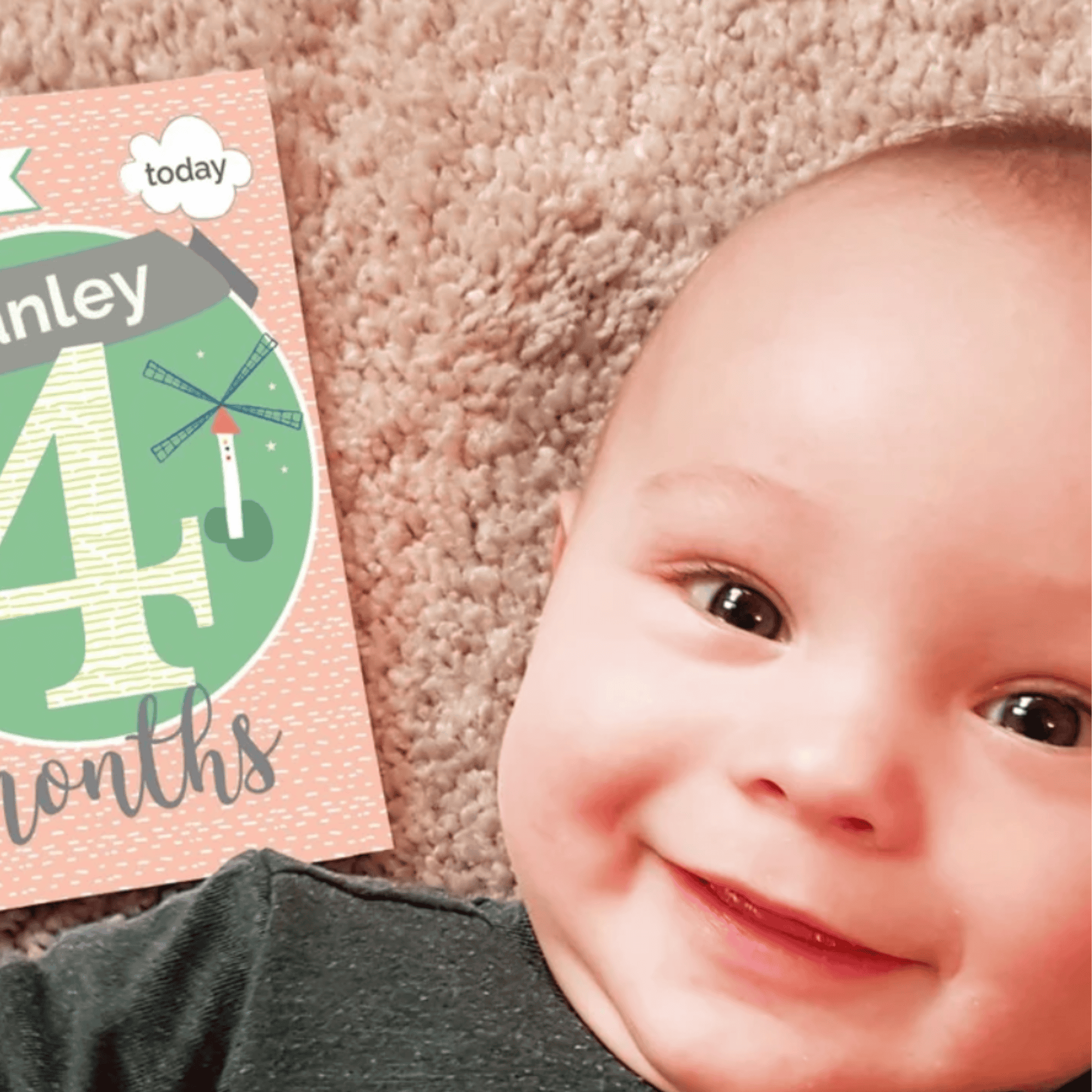 an image showing a smiling baby beside a personalised milestone card