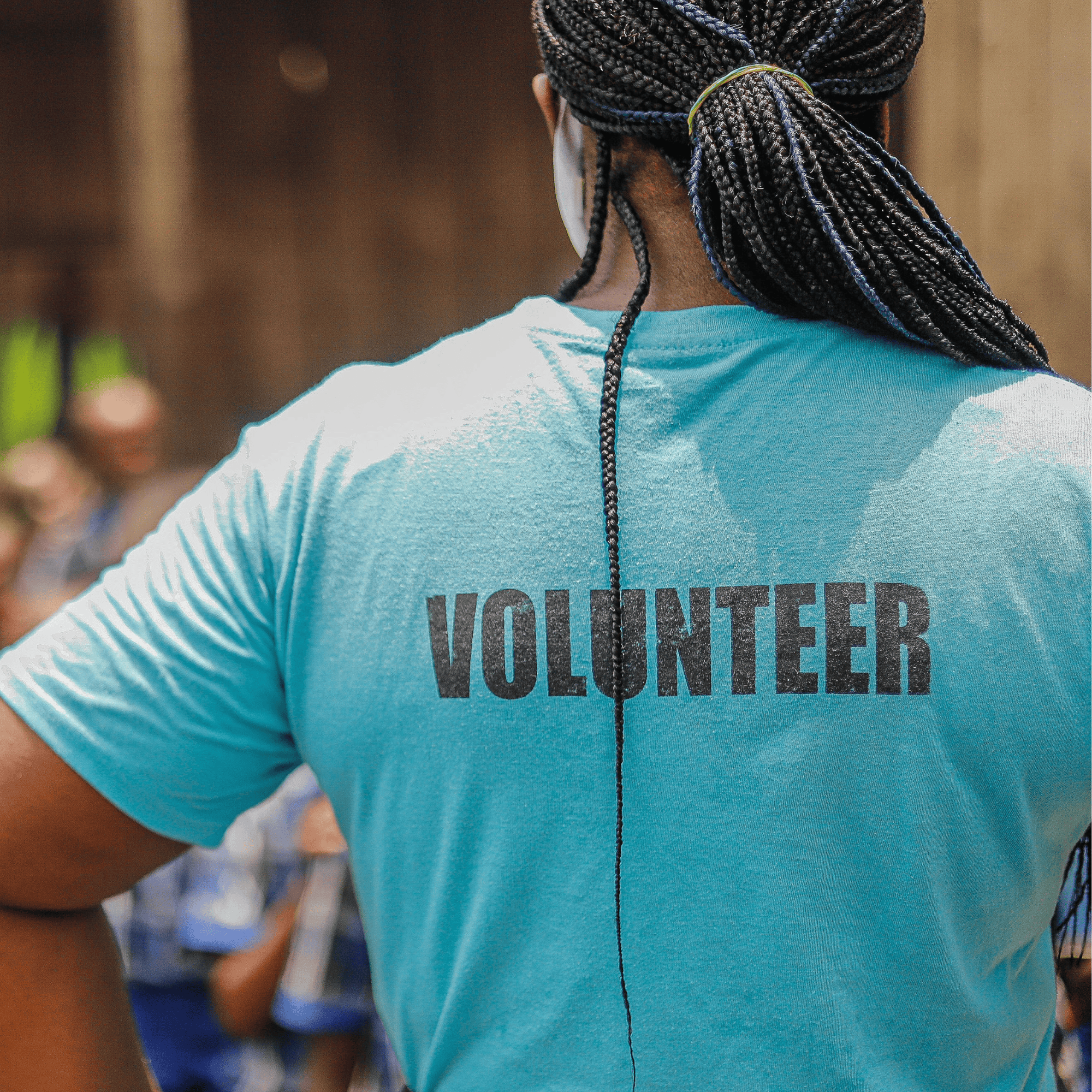 picture of a person volunteering with a volunteer t-shirt on