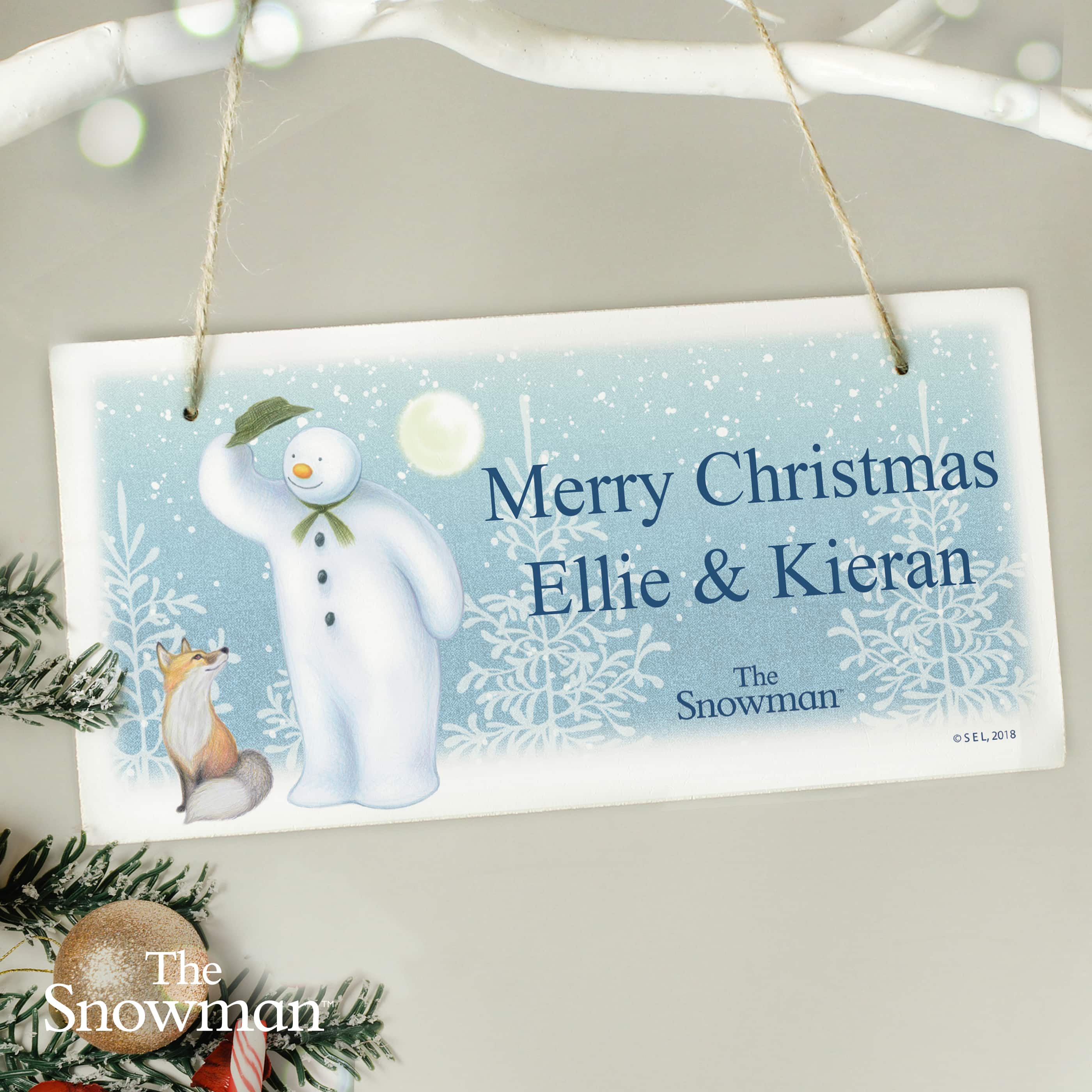 personalised wooden snowman sign showing the names on the front
