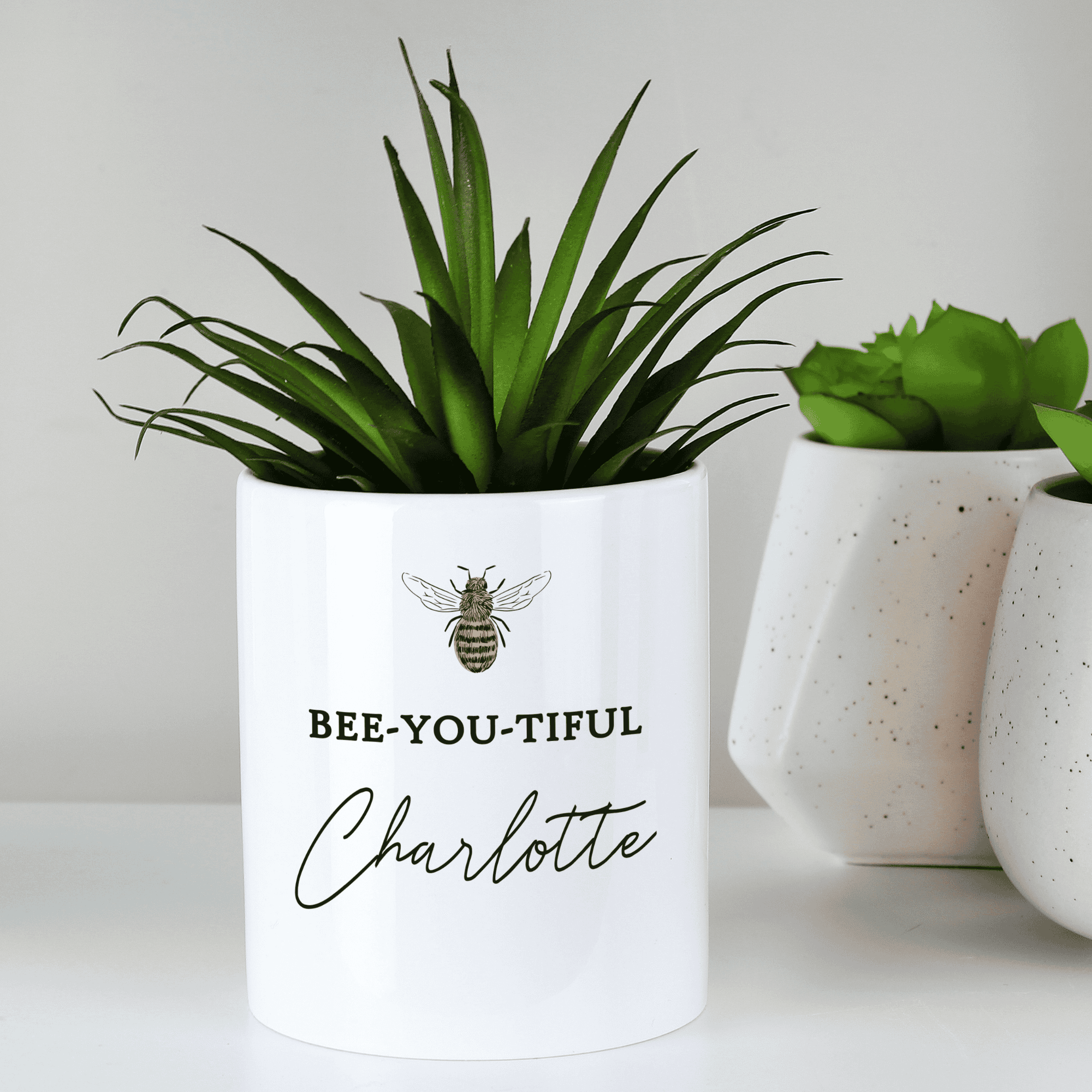personalised bee-utiful ceramic storage pot with a bee on the front and any name personalised on it