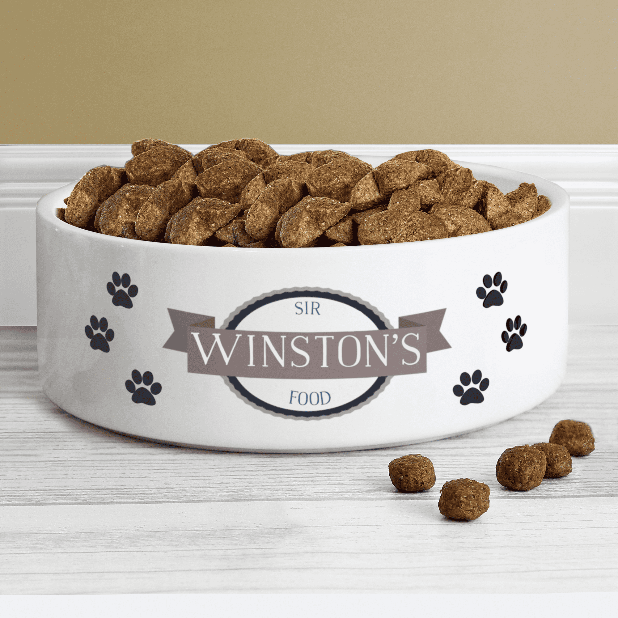 Personalised ceramic pet bowl with pawprints and a message over 3 lines
