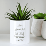 personalised ceramic storage pot. white with a botanical design and personalised over 4 lines with the name in big writing
