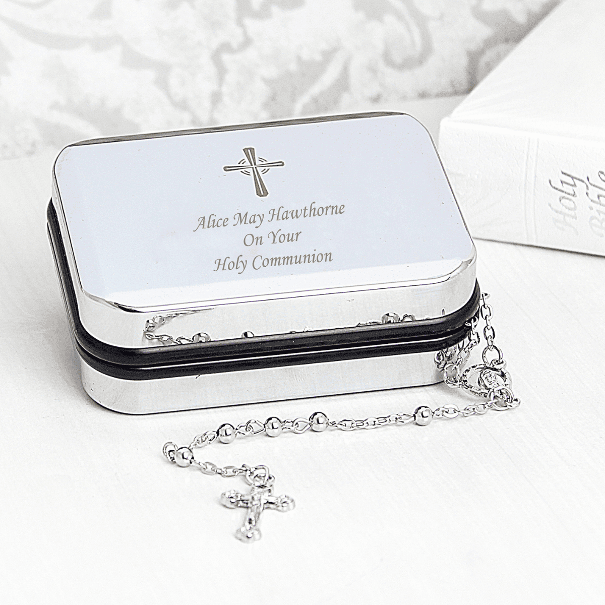 catholic rosary beads and trinket box showing the engraving of the chosen message on the front
