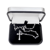 catholic rosary beads and trinket box showing the inside of the box with beads in it.