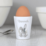 white ceramic easter bunny egg cup showing the personalisation on the front above the bunny design
