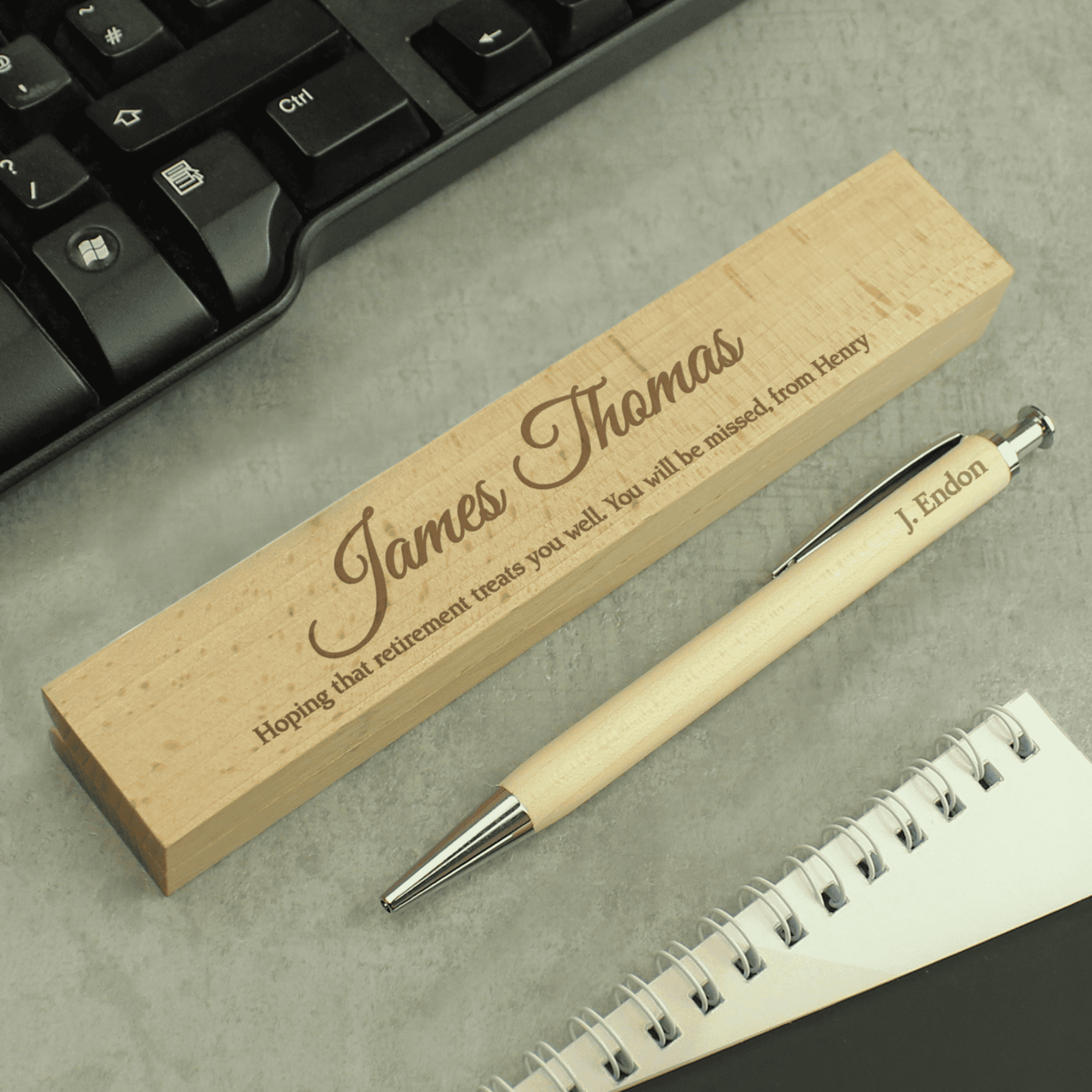 personalised wooden pen box set engraved with a message over 2 lines on the box and a name on the pen