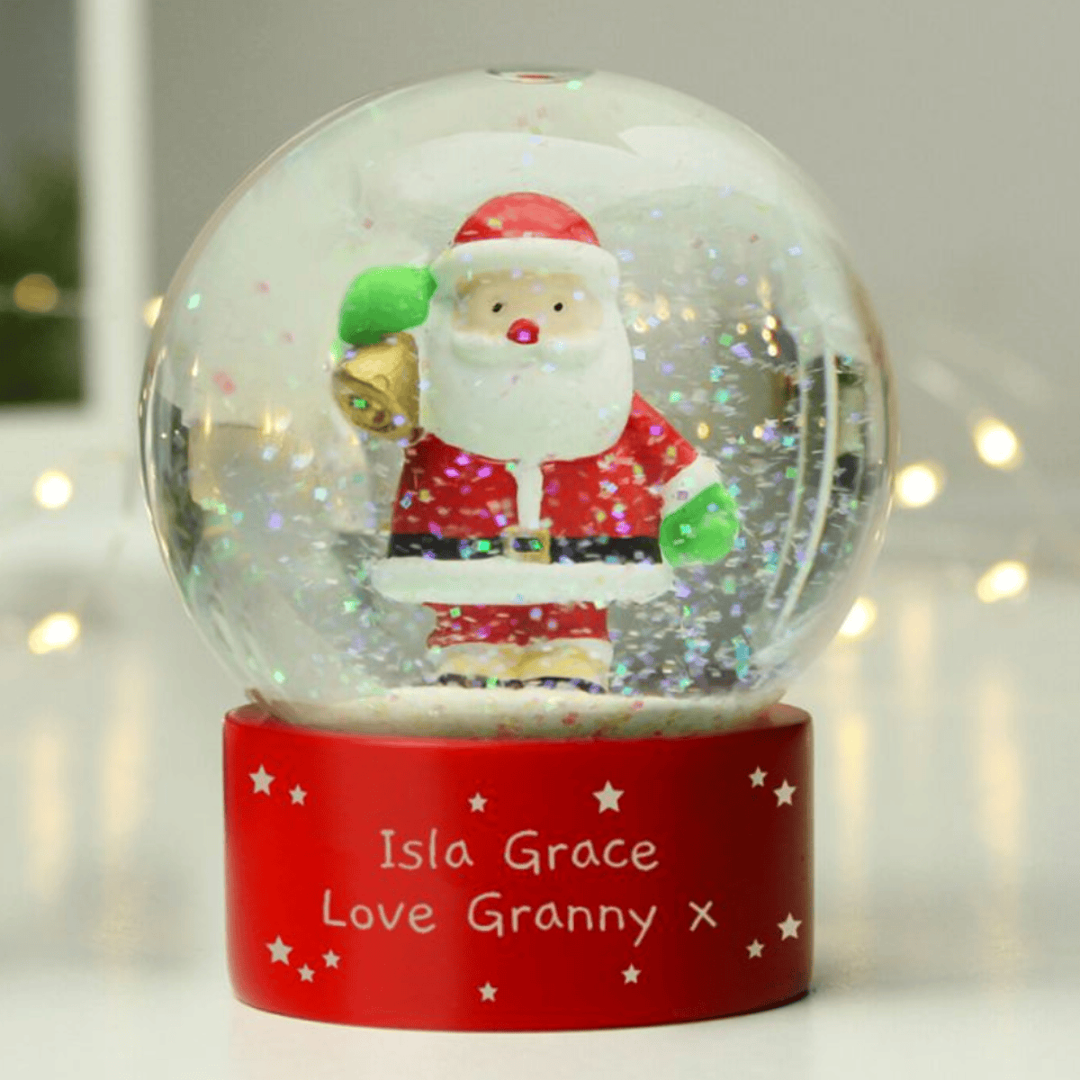personalised santa snow globe showing the personalisation on the front
