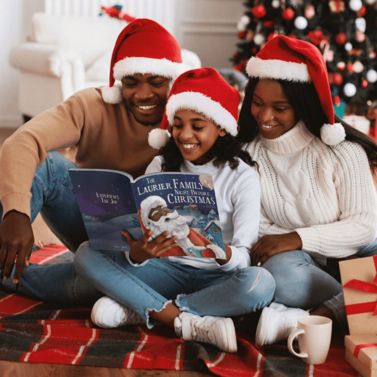 A family with christmas hats on reading the personalised night before christmas book together