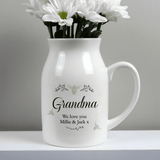 personalised ceramic jug vase with a floral bee design and a name in larger font and message over 2 lines underneath