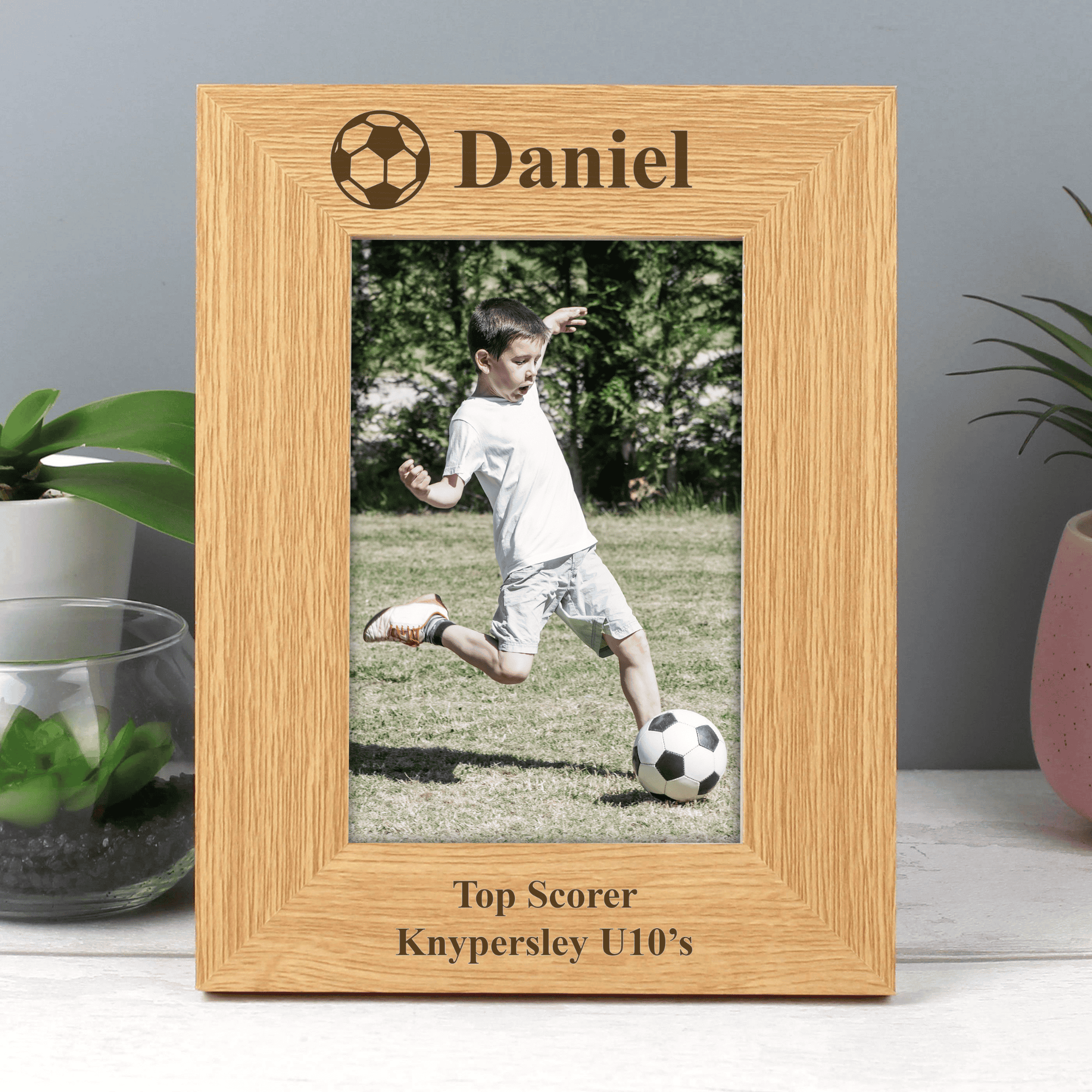 personalised football photo frame with a message above the photo and 2 lines below