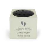 personalised footprint memorial with the child's name and date engraved on the front