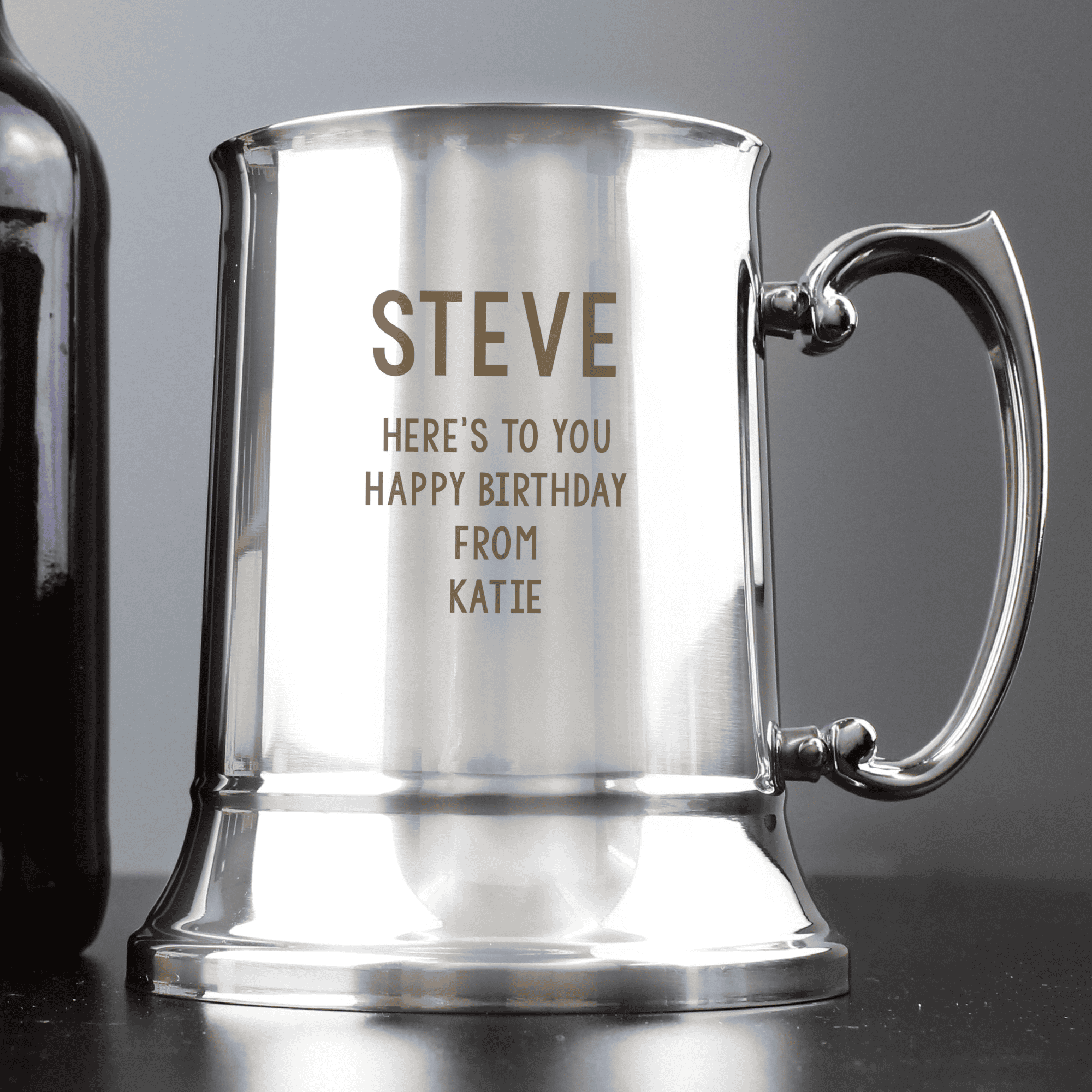 engraved steel tankard personalised with a name in larger font and a message over 4 lines on the front