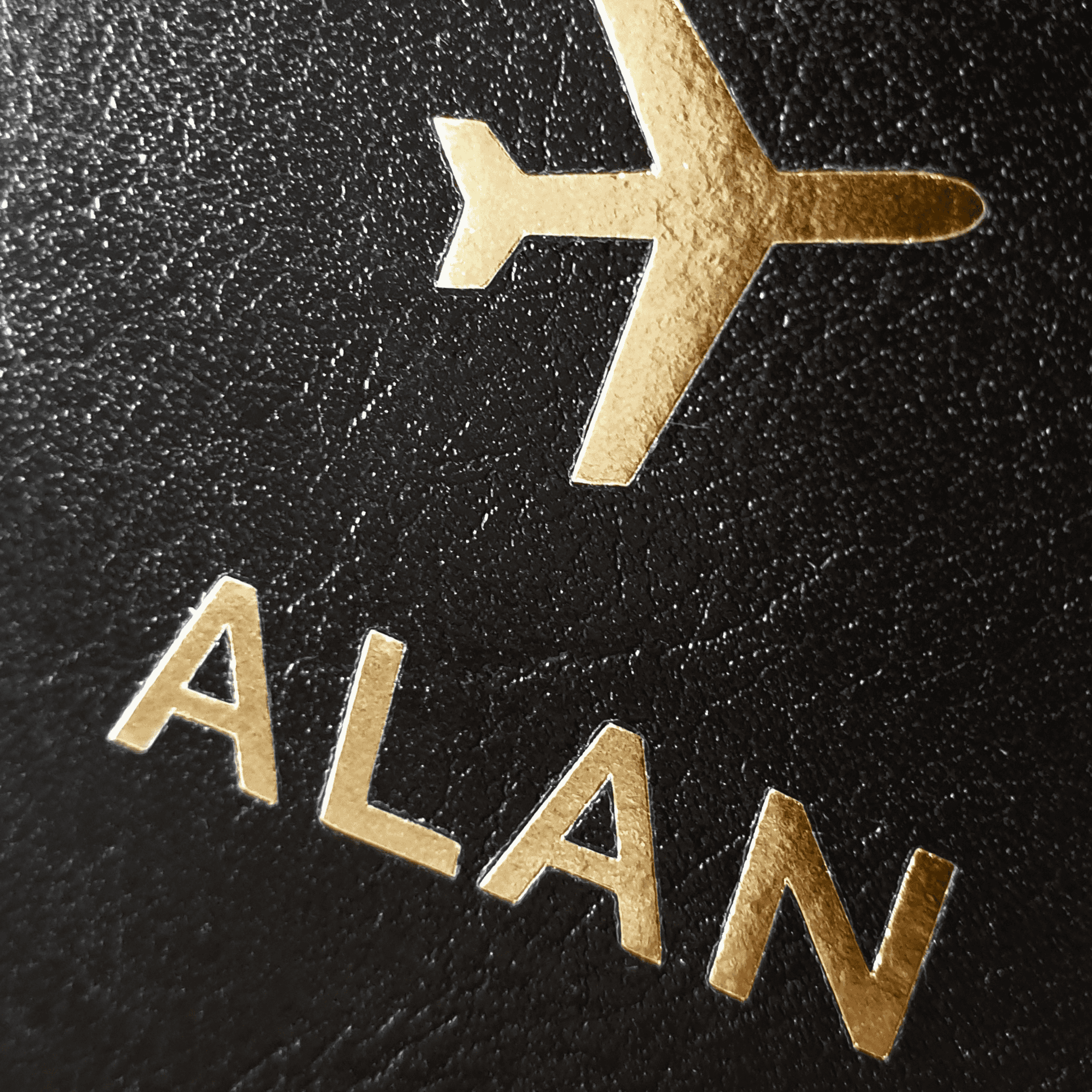 Personalised gold letter passport covers. one is black one is cream
