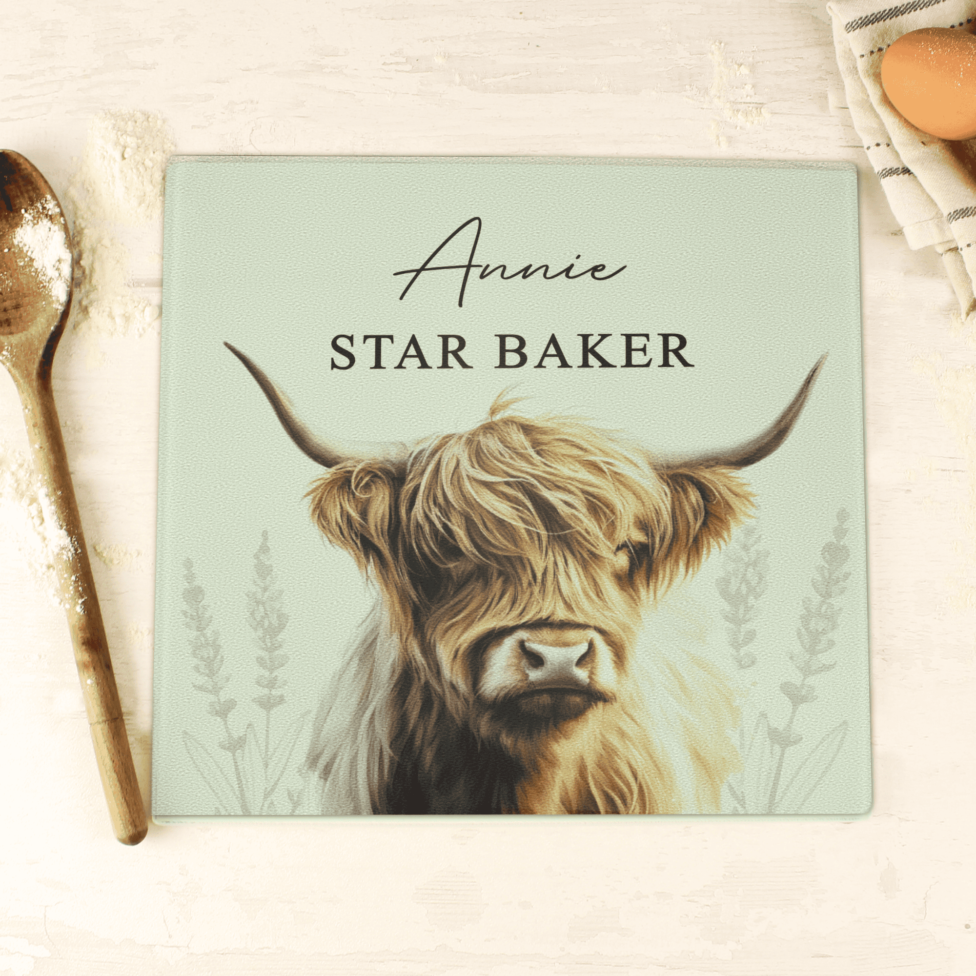 personalised highland cow glass chopping board