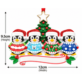 personalised penguin jumper christmas tree decoration for 2-6 people names go on the hats and a short message underneath