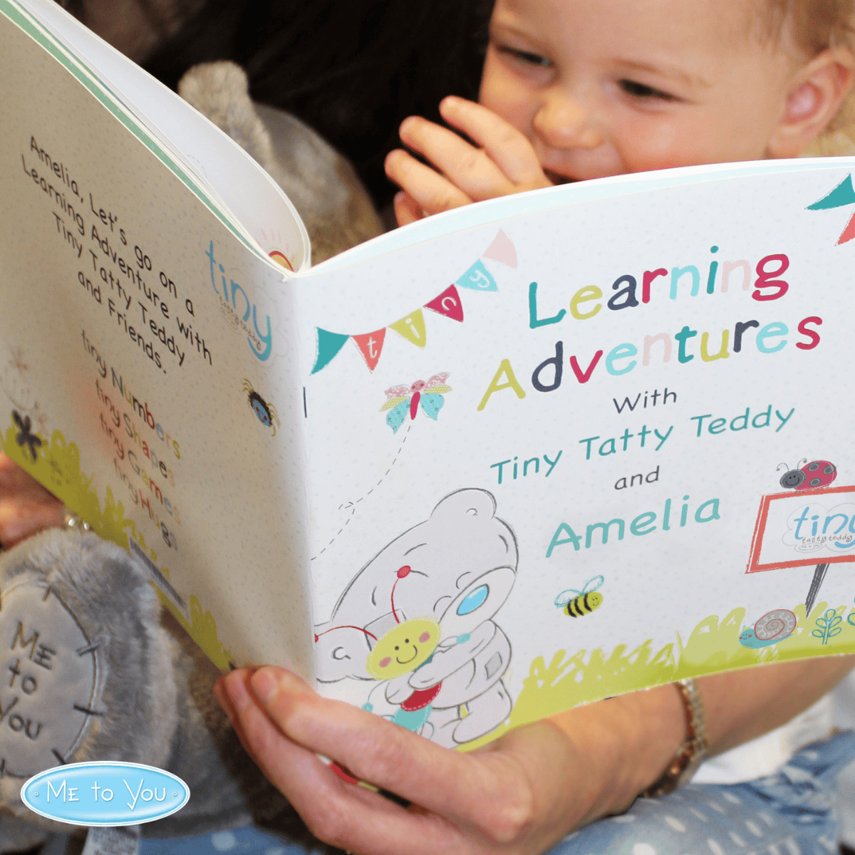 personalised Tiny Tatty learning book showing the front cover with the child's name on the book and the child reading it with an adult
