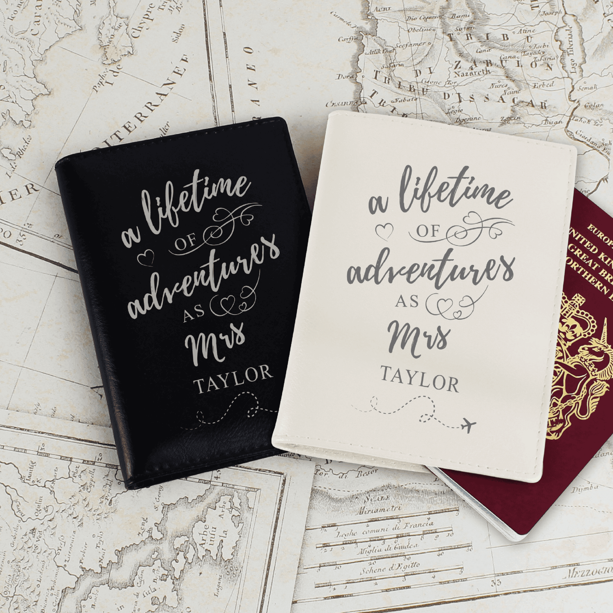 personalised lifetime of adventure passport cover set. one is black. one is cream