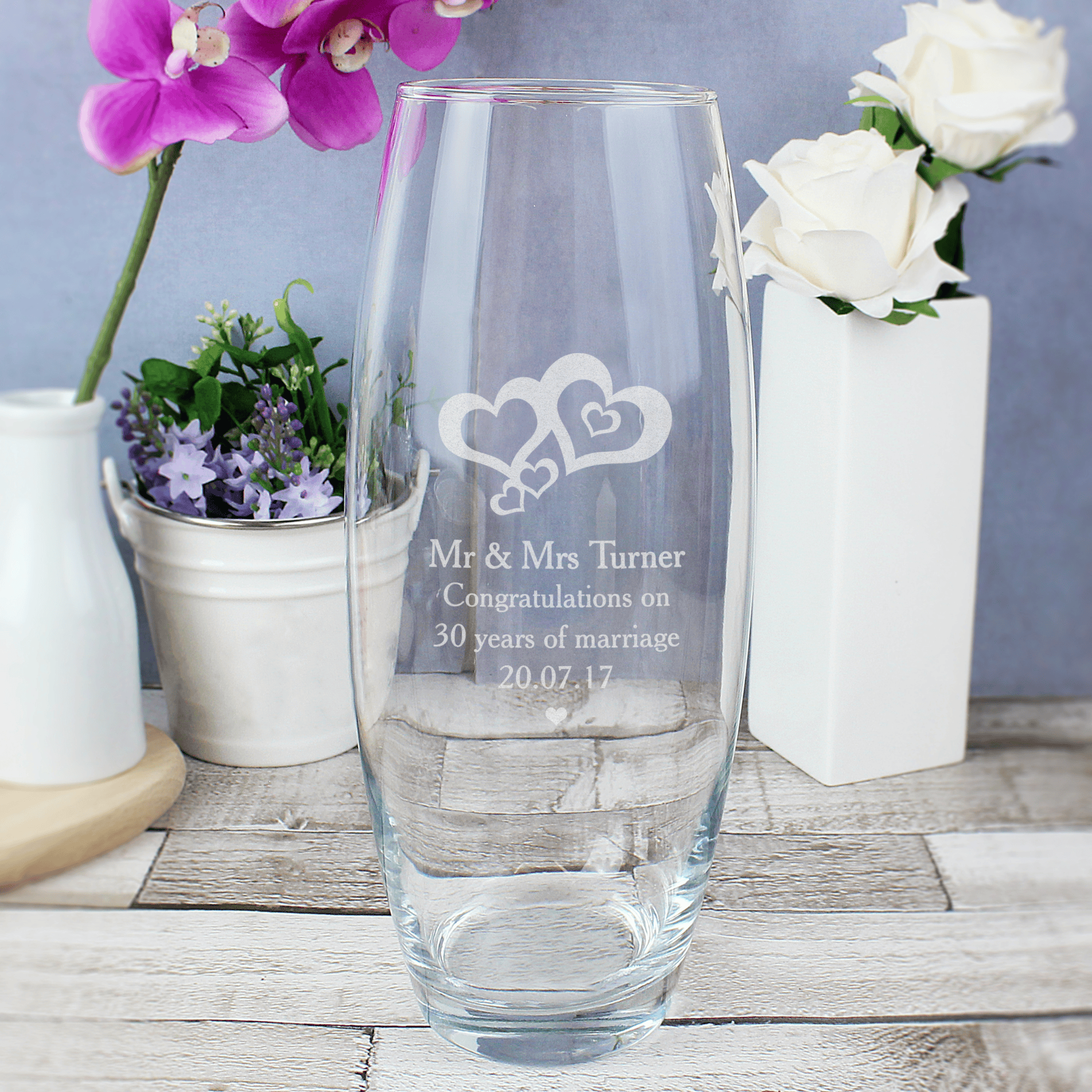 personalised love hearts bullet vase engraved with a message over 3 lines underneath the 2 engraved hearts design
