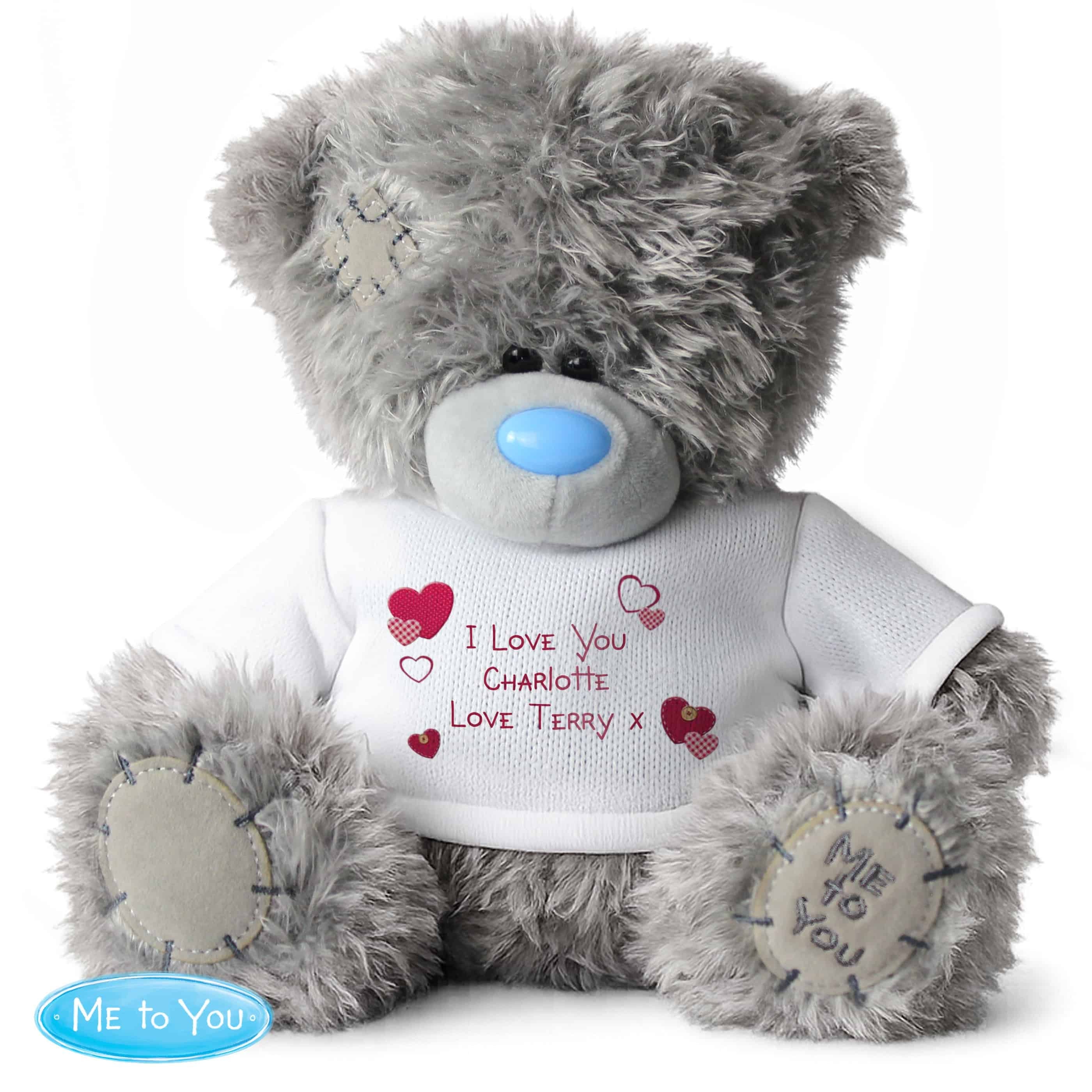 personalised teddy bear with a white jumper and personalisation over 3 lines in red