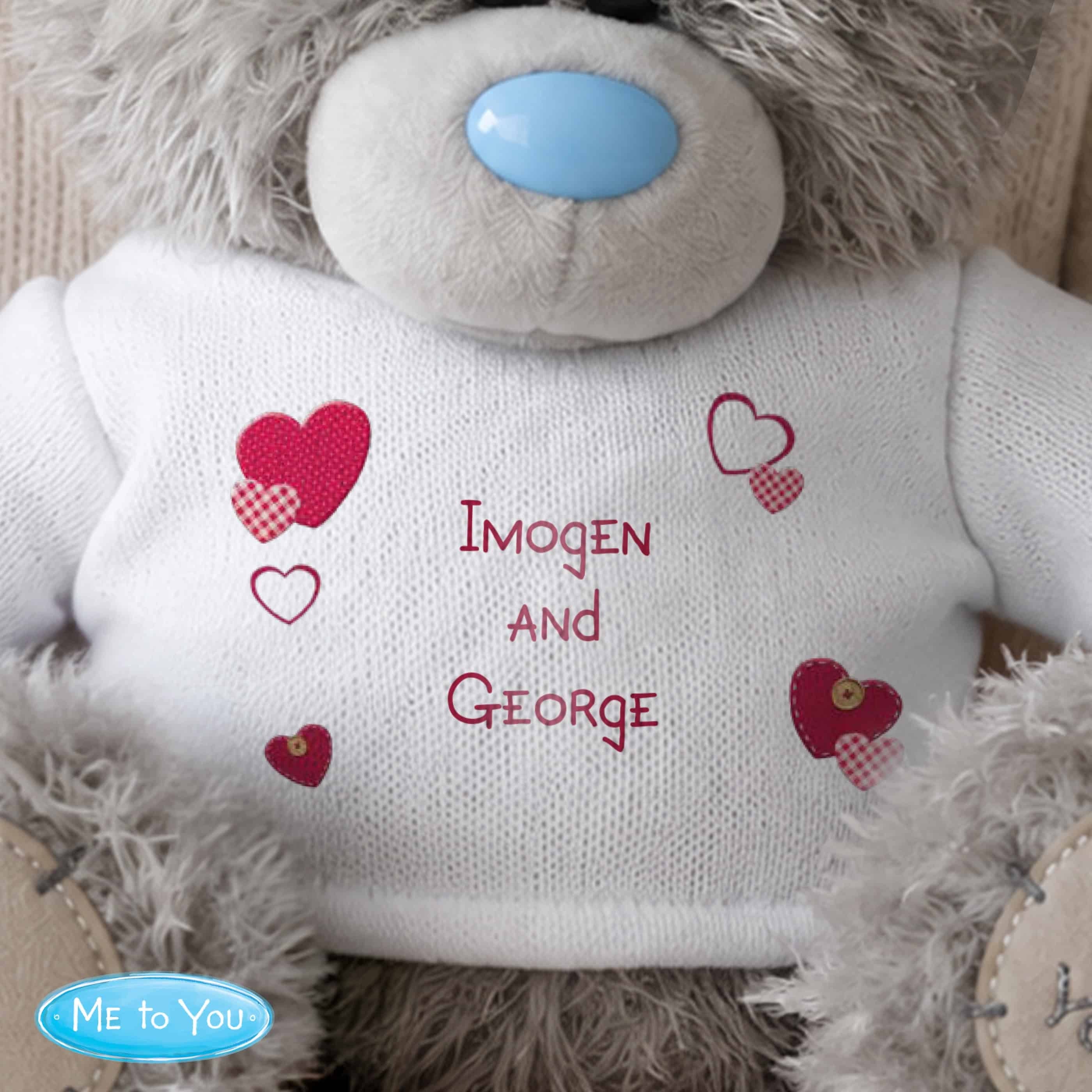 personalised teddy bear with a white jumper and personalisation over 3 lines in red