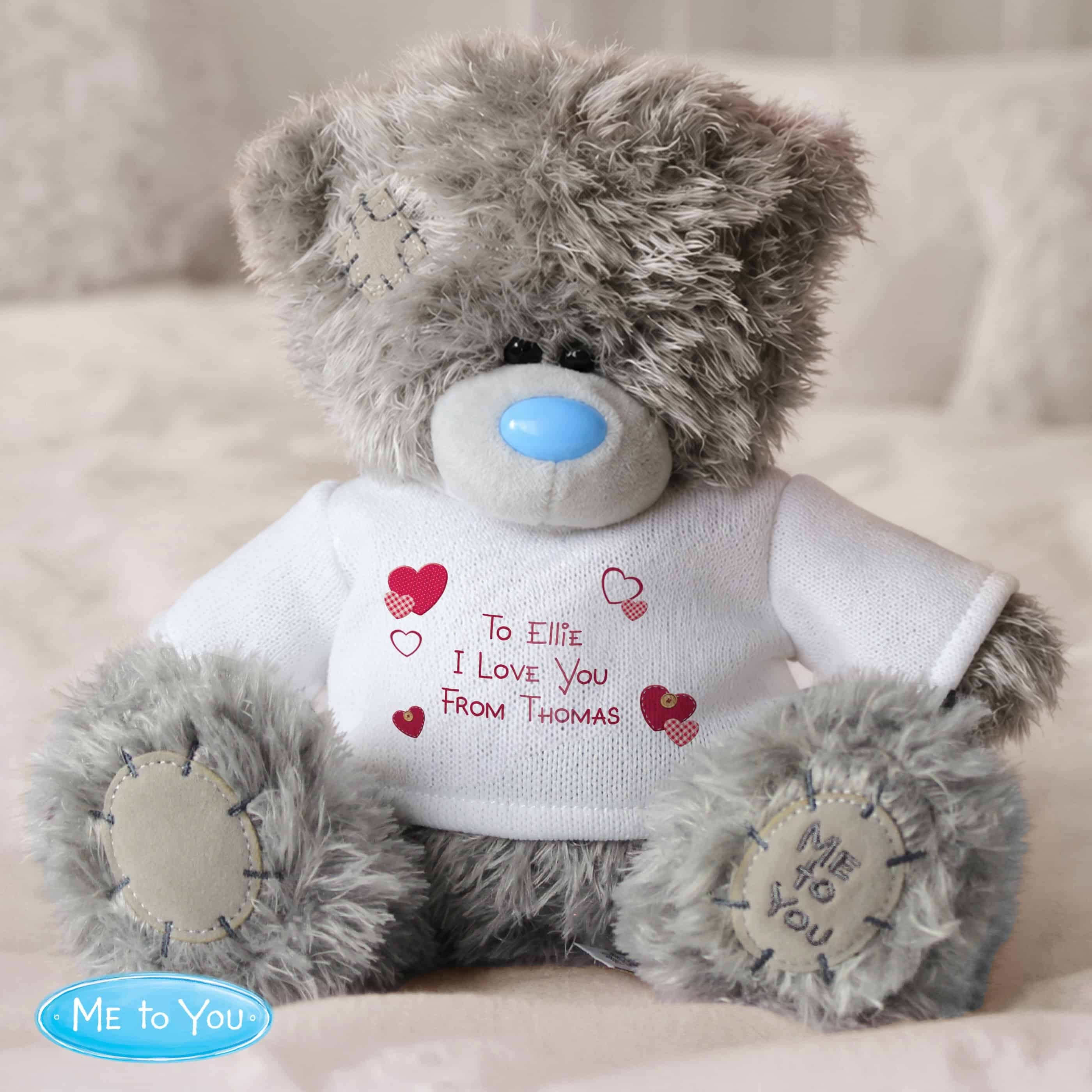 personalised teddy bear with a white jumper and personalisation over 3 lines in red
