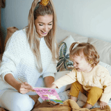 Woman and child reading Hello World personalised book on a couch
