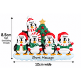 personalised penguin christmas tree decoration with names hand personalised on the hats and a short message or year written underneath