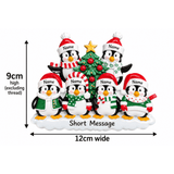 personalised penguin christmas tree decoration with names hand personalised on the hats and a short message or year written underneath