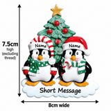 personalised penguin christmas tree decoration with names hand personalised on the hats and a short message or year written underneath