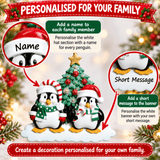 personalised penguin christmas tree decoration with names hand personalised on the hats and a short message or year written underneath