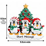 personalised penguin christmas tree decoration with names hand personalised on the hats and a short message or year written underneath