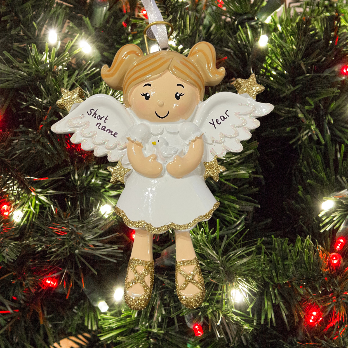 personalised angel christmas tree decoration showing the personalisation on the wings