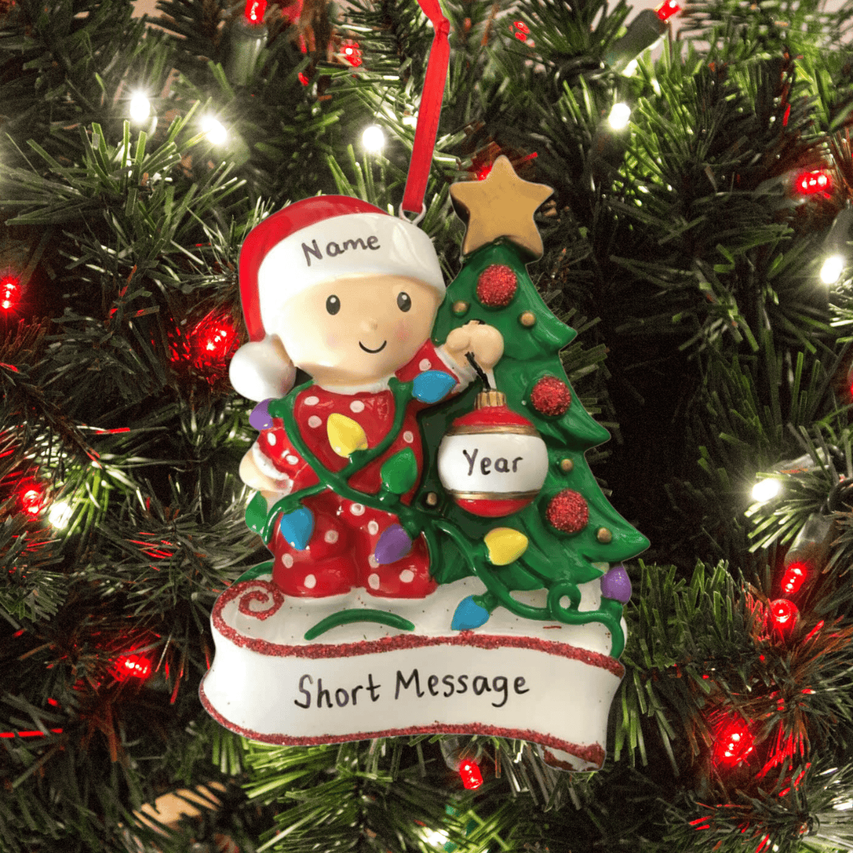 personalised baby decorating a tree christmas tree ornament