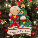 personalised baby decorating a tree christmas tree ornament