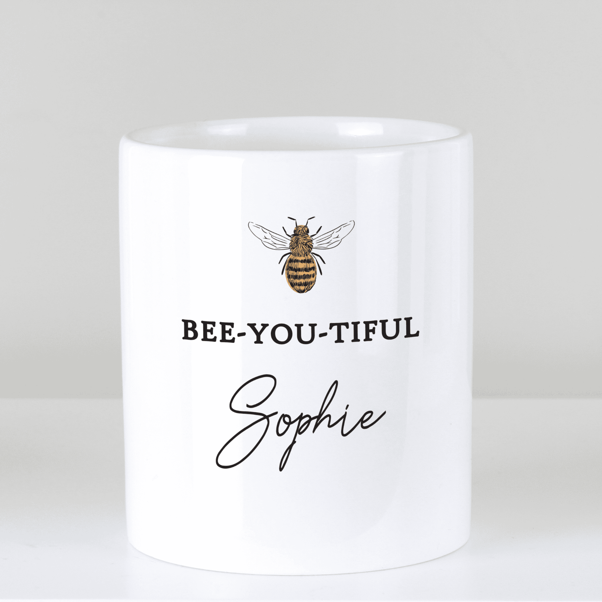 personalised bee-utiful ceramic storage pot with a bee on the front and any name personalised on it