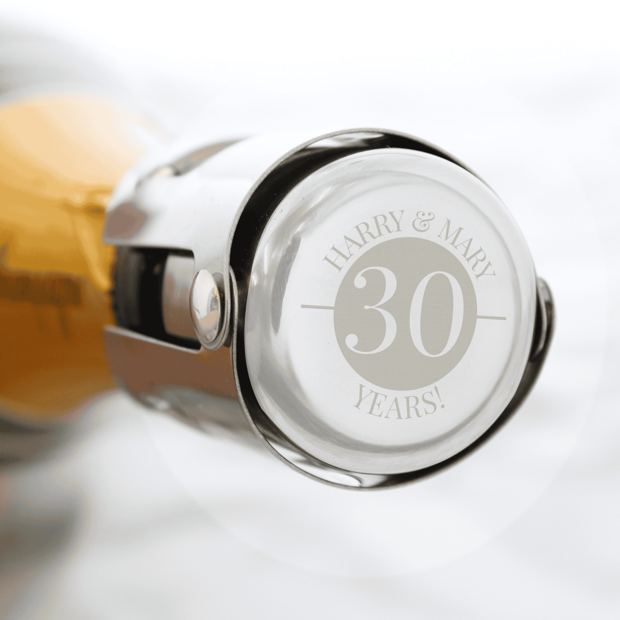 personalised metal bottle stopper that can be engraved with a year and a message above and below it