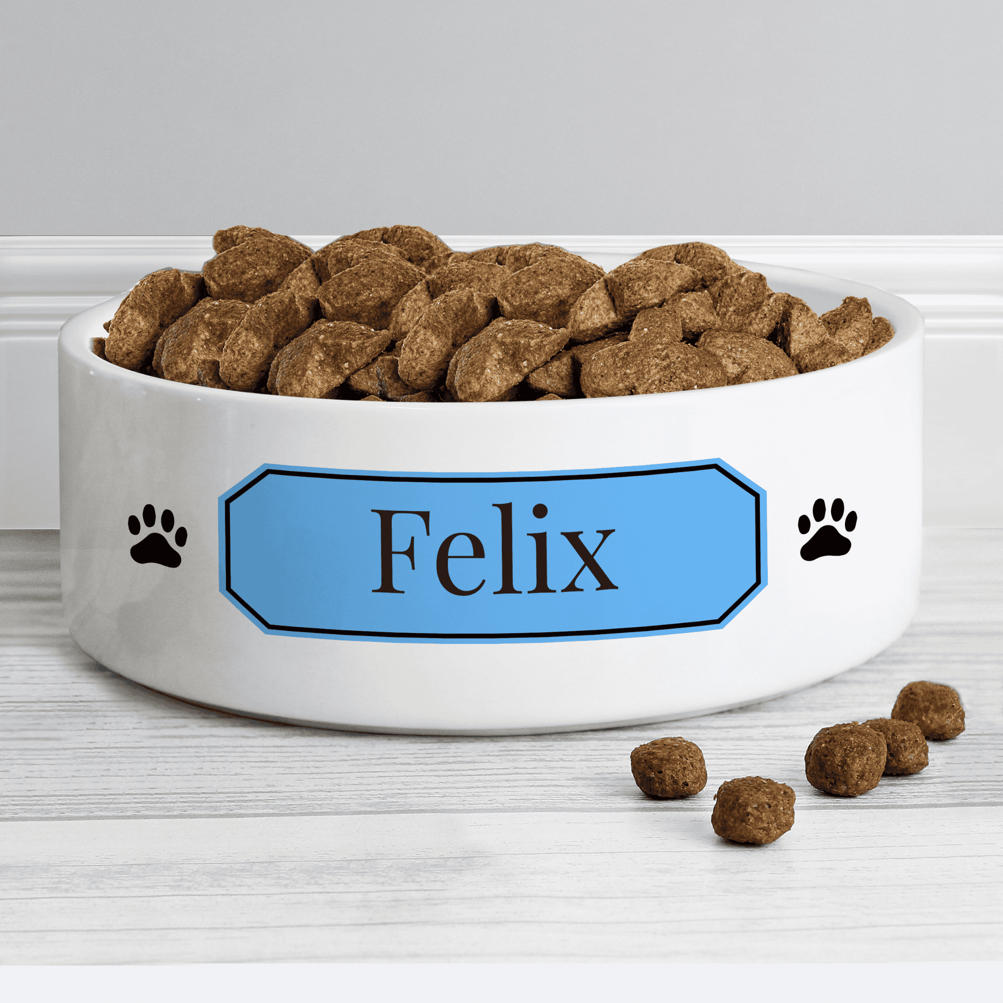 personalised ceramic pet bowl with any name on a blue plaque.
