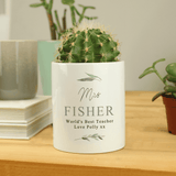 personalised ceramic storage pot. white with a botanical design and personalised over 4 lines with the name in big writing