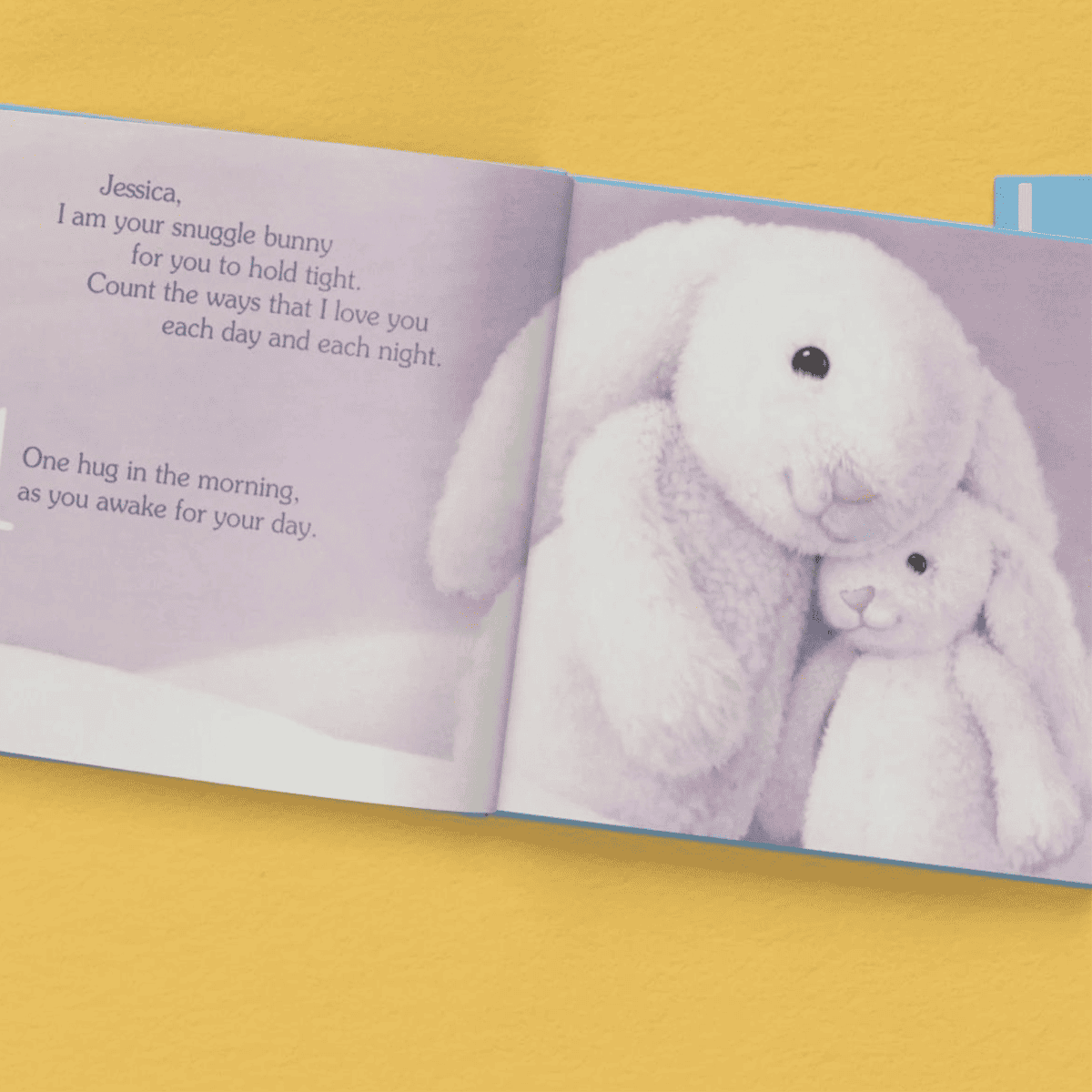 open pages showing the child's name personalised inside the snuggle bunny book