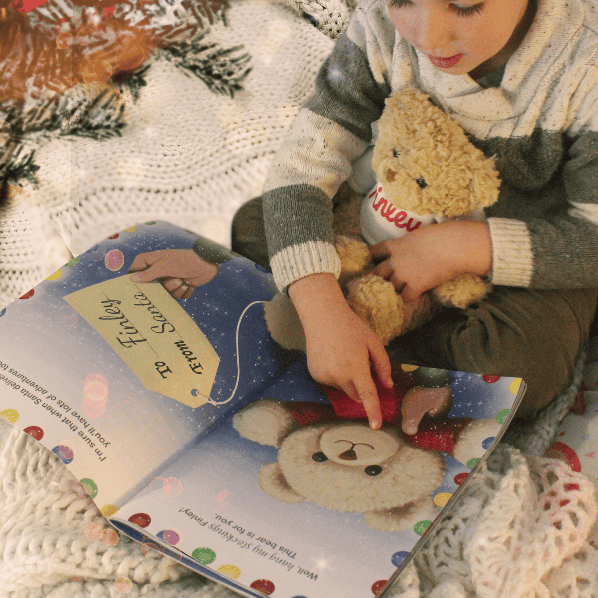 personalised christma story book showing the pages illustrated inside and a children holding their personalised teddy