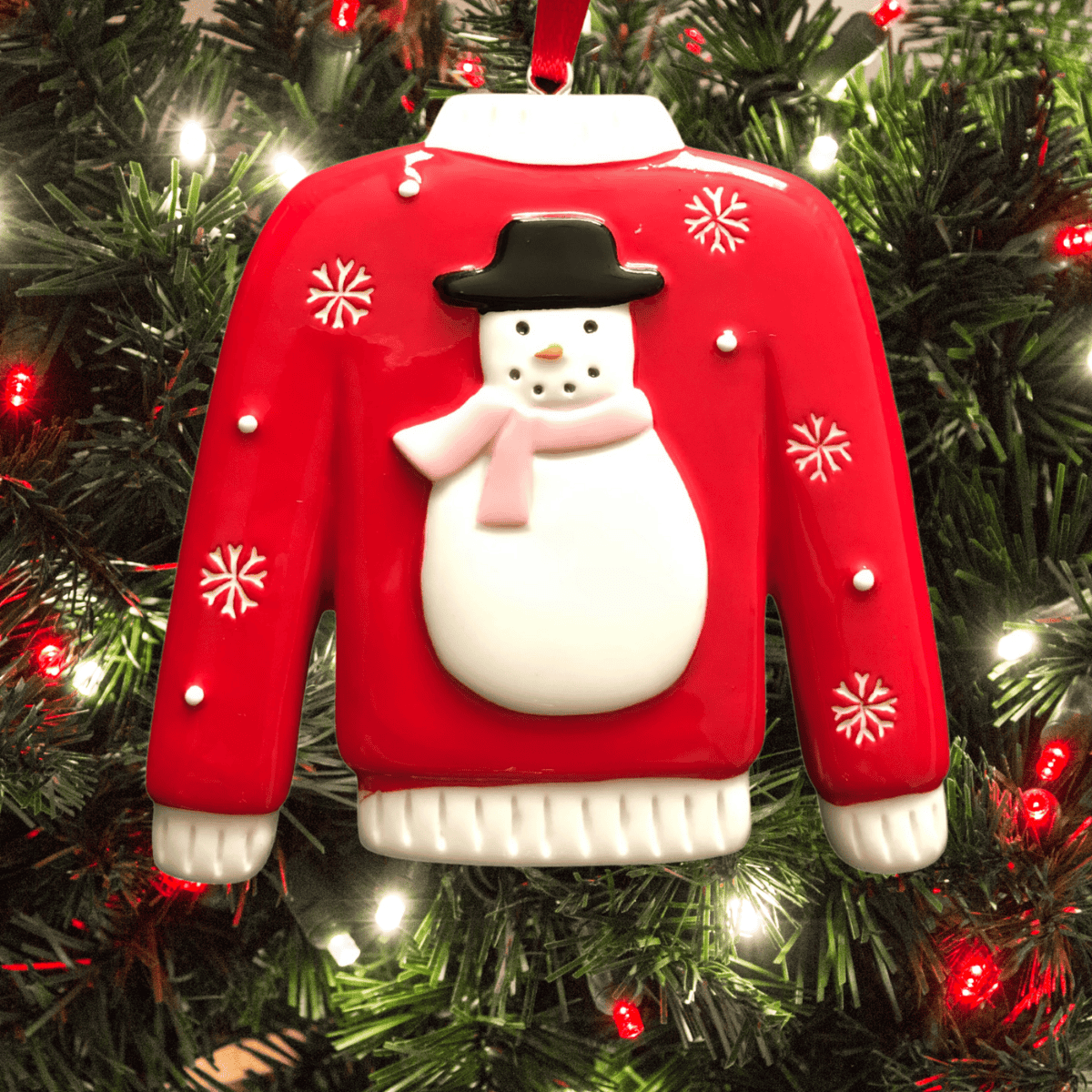 personalised jumper christmas tree decoration with a snowman with a pink scarf
