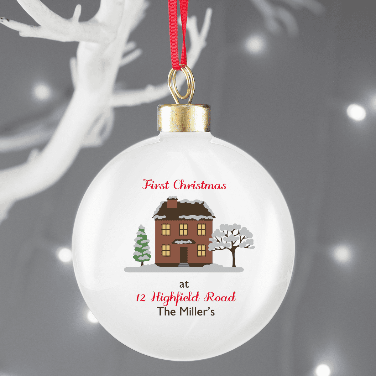 personalised cosy home ceramic bauble showing the personalisation on the front 