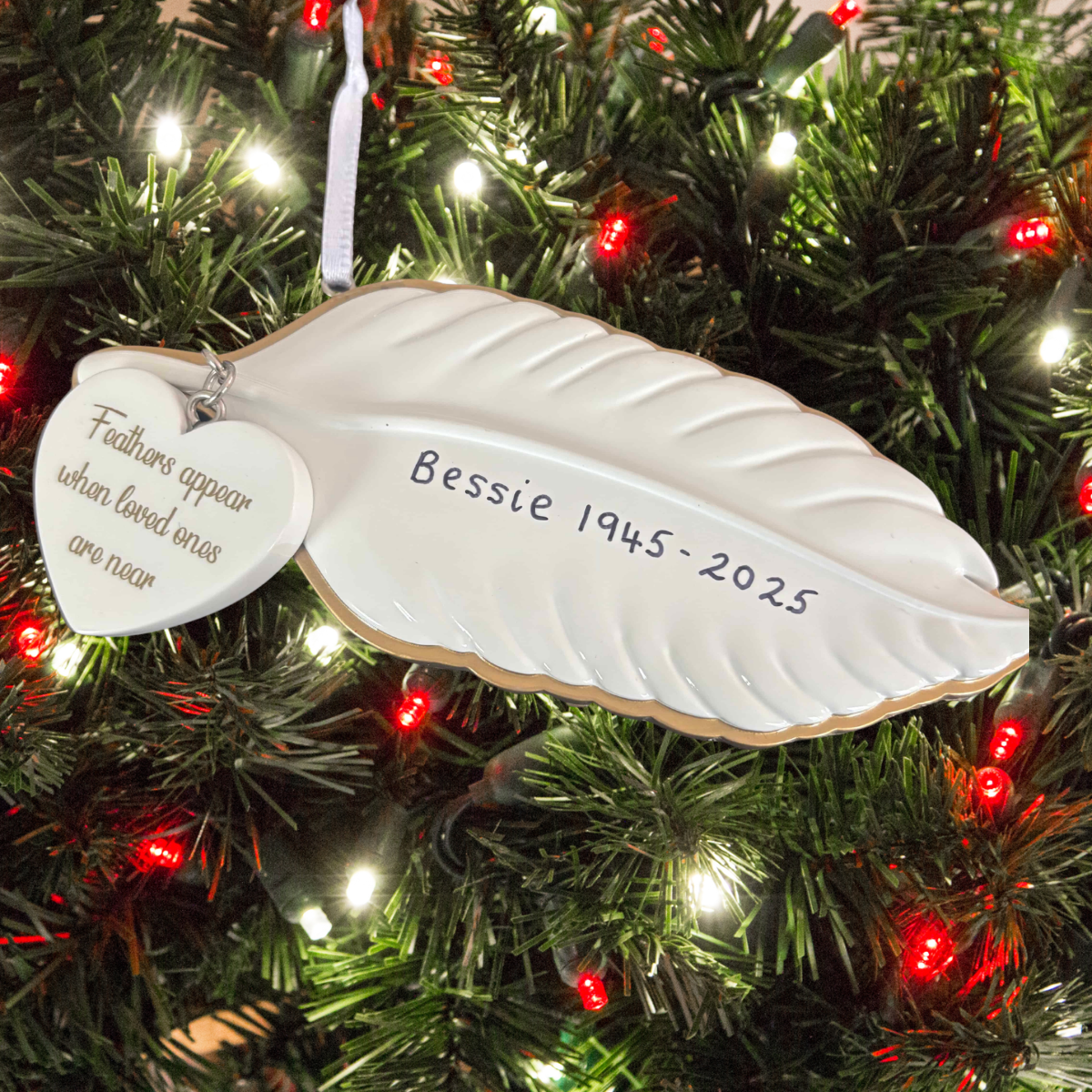 personalised white feather hanging decoration showing the message on the heart