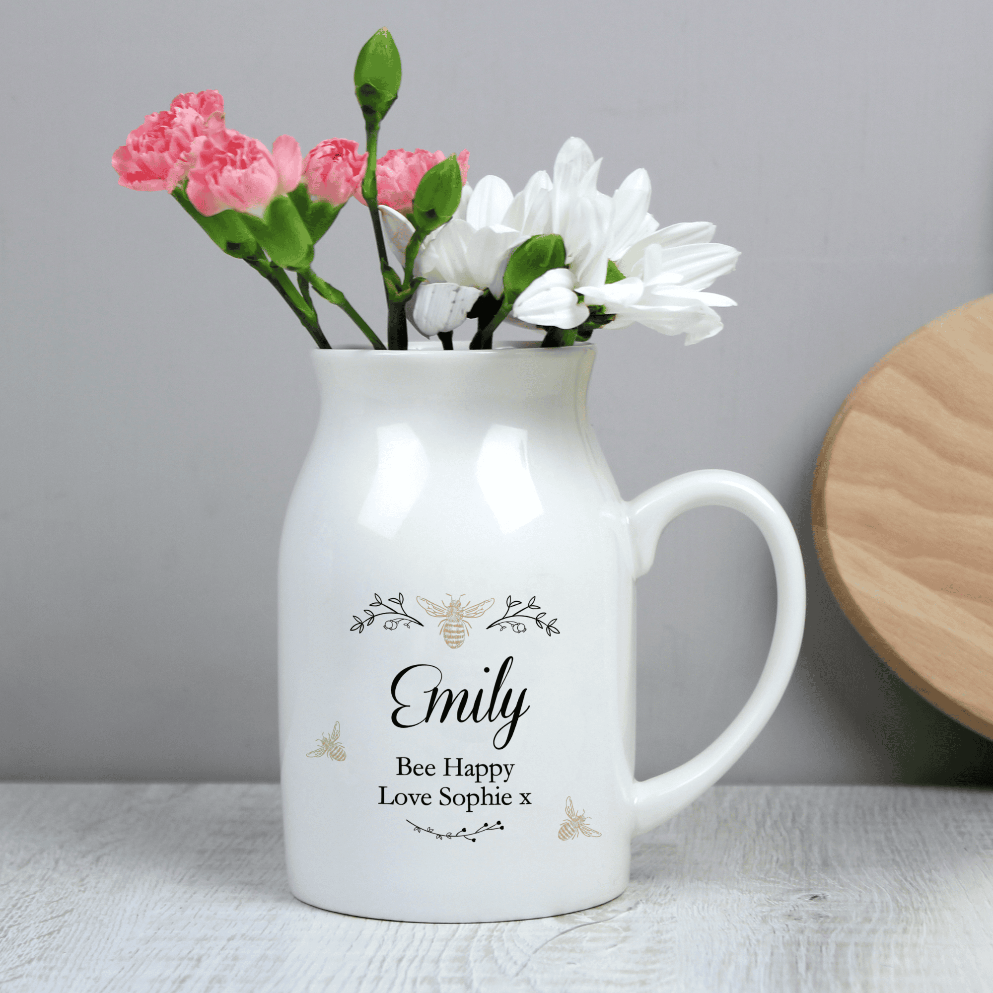 personalised ceramic jug vase with a floral bee design and a name in larger font and message over 2 lines underneath
