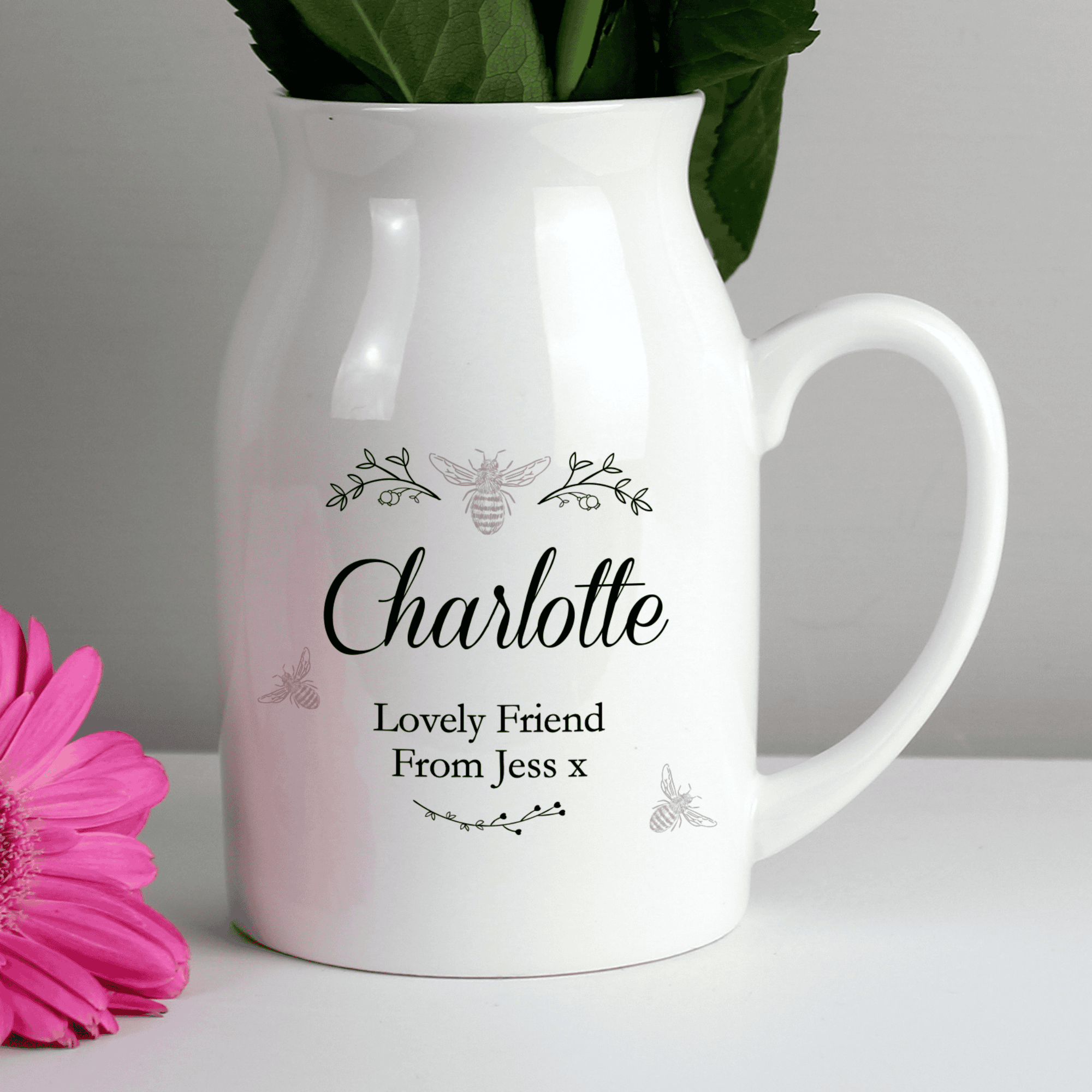 personalised ceramic jug vase with a floral bee design and a name in larger font and message over 2 lines underneath