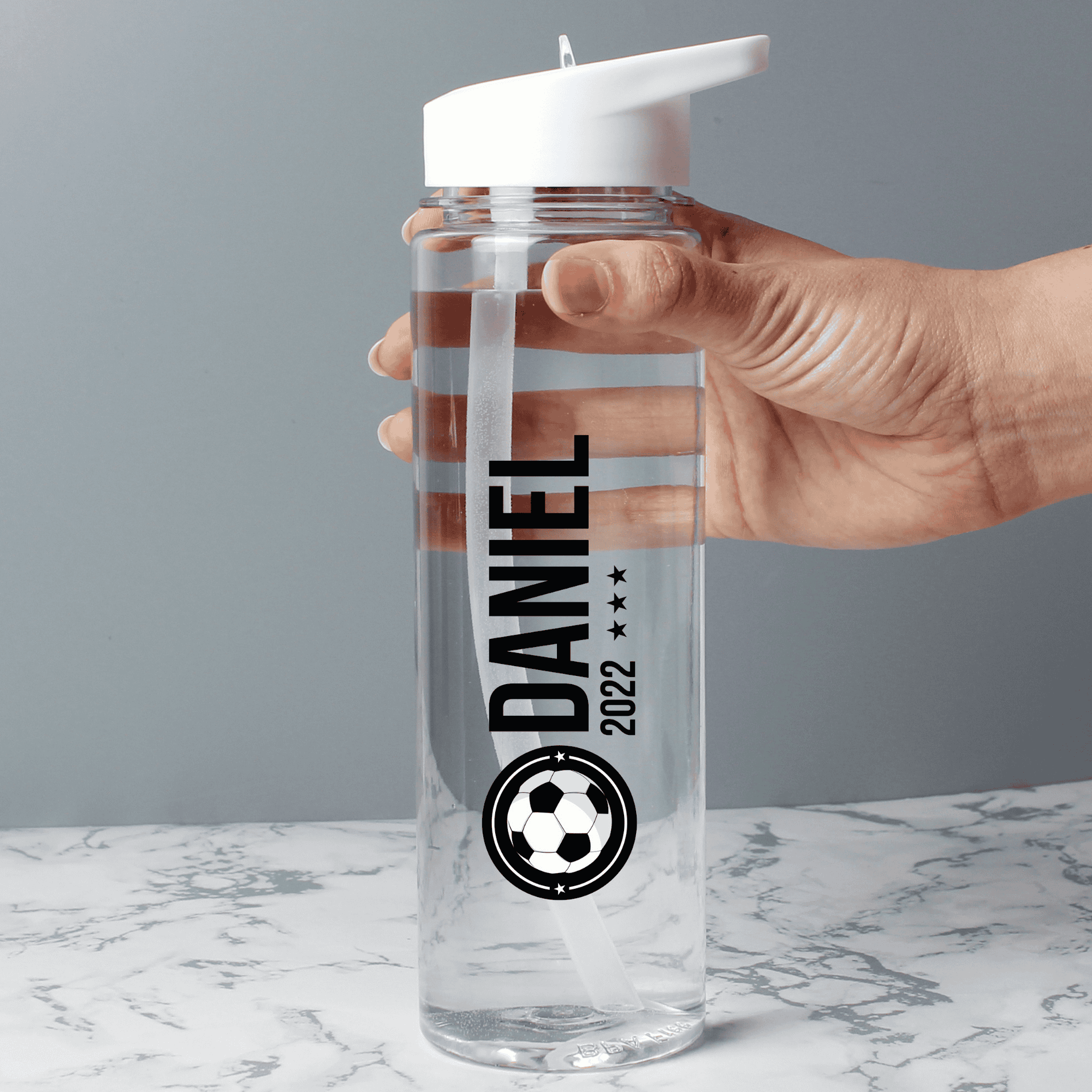 personalised football badge water bottle with any name and year on the front of the bottle