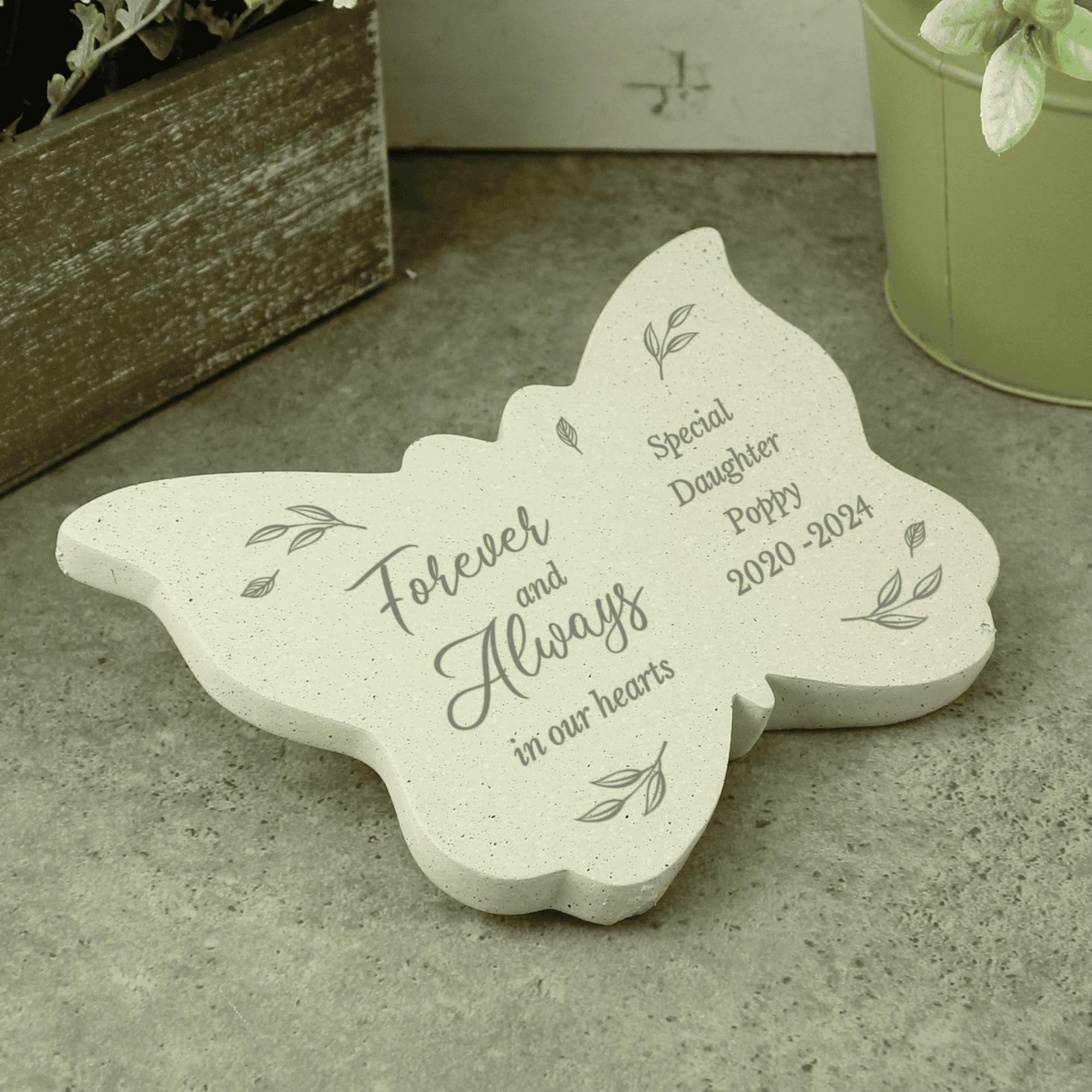 butterfly memorial stone with  the message forever and always in our hearts on the left wing and any message engraved over 4 lines on the right wing