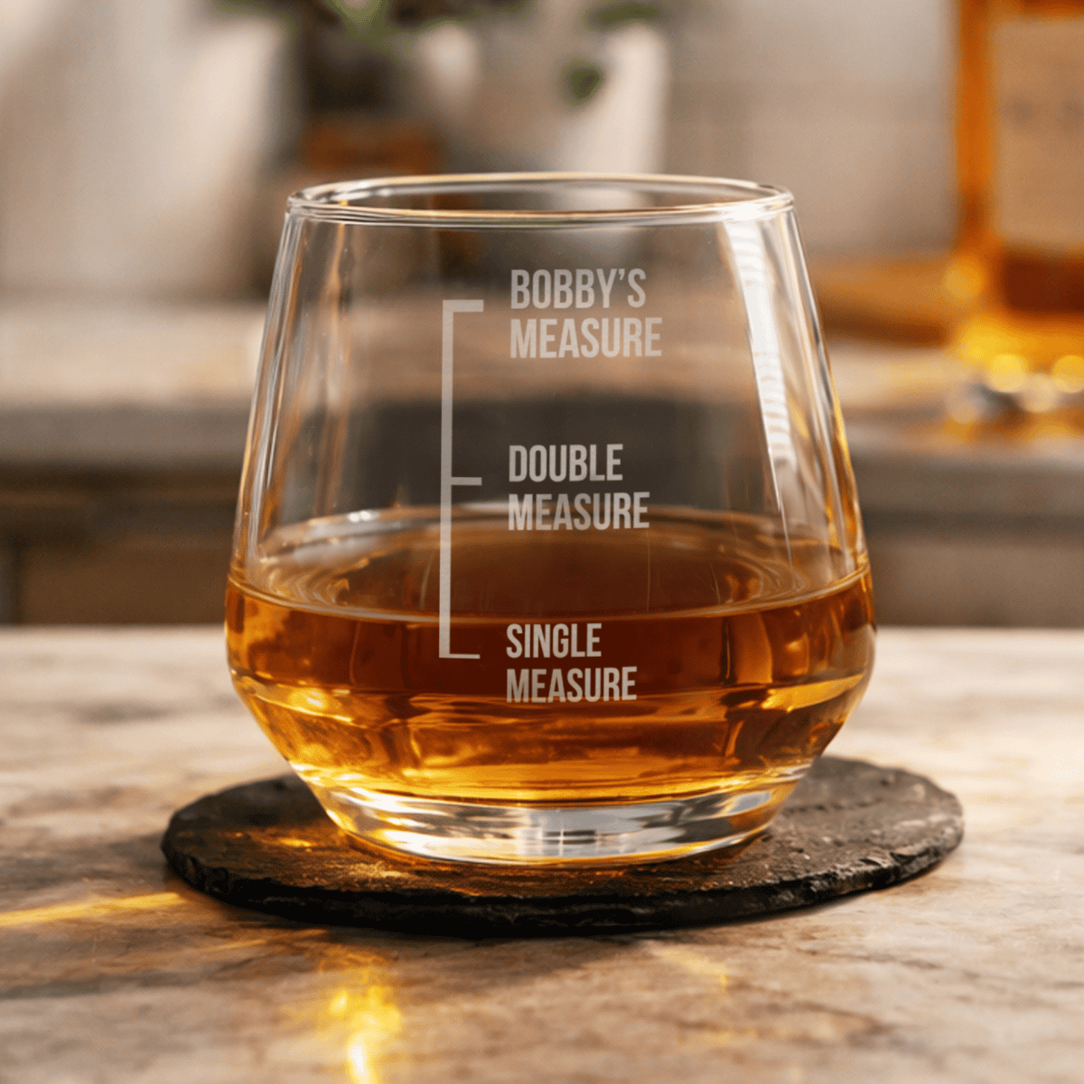 personalised glass whisky tumbler showing the name engraved on the glass