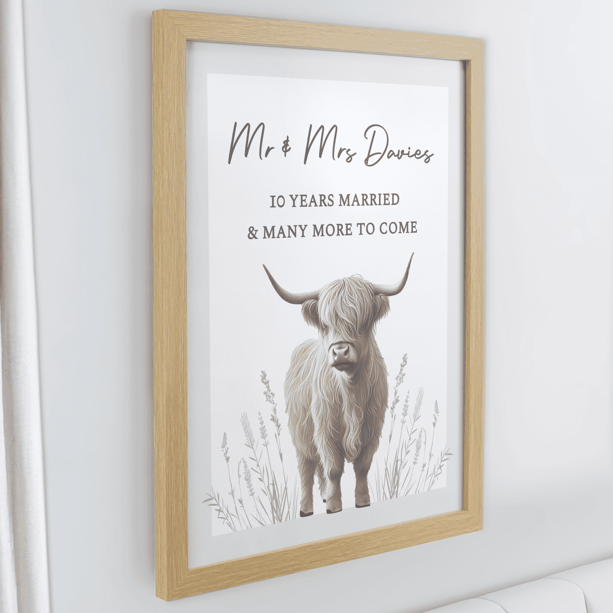 personalised highland cow framed print personalised over 3 lines above the highland cow image