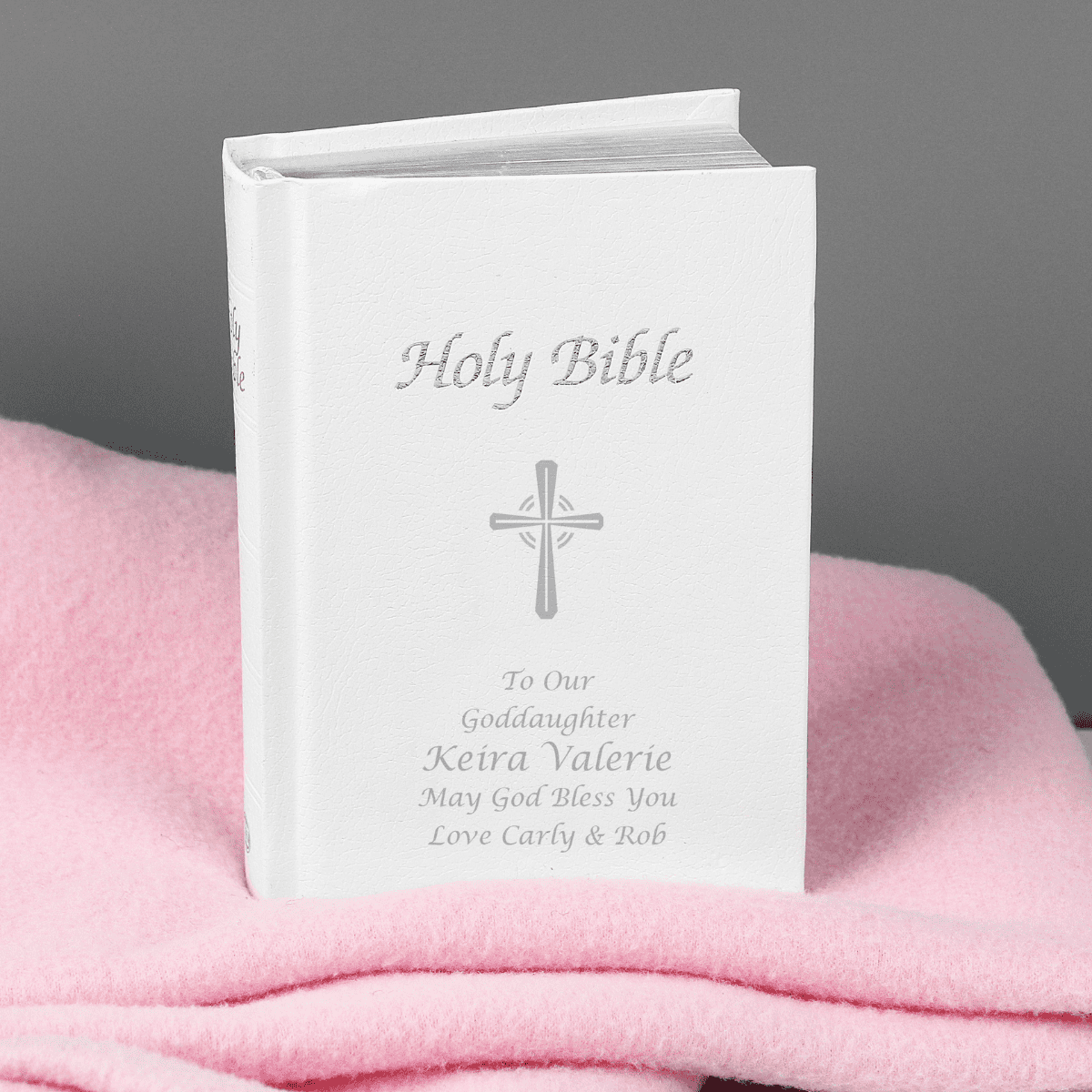 personalised holy bible with a silver cross on the front and 5 lines of personalisation underneath